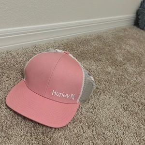 pink and white Hurley hat
